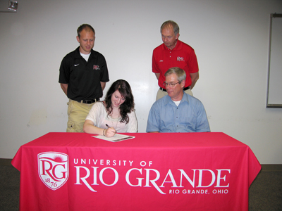 Jessica Reckner is joined by her father, Bill, and Rio Grande coaches as she signs to run for the RedStorm